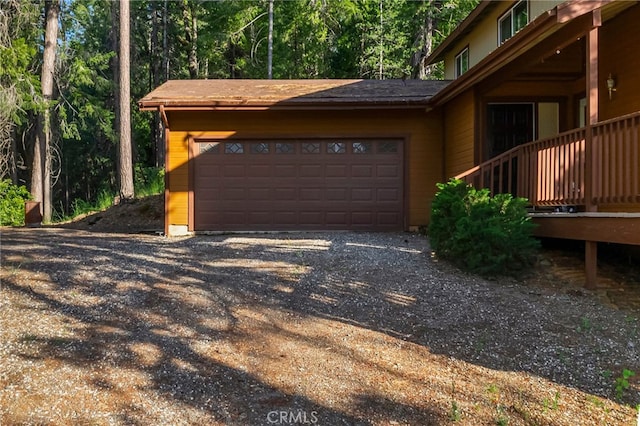 64 Rebie Way, Oroville, CA 95966 - garage featuring a wooded view