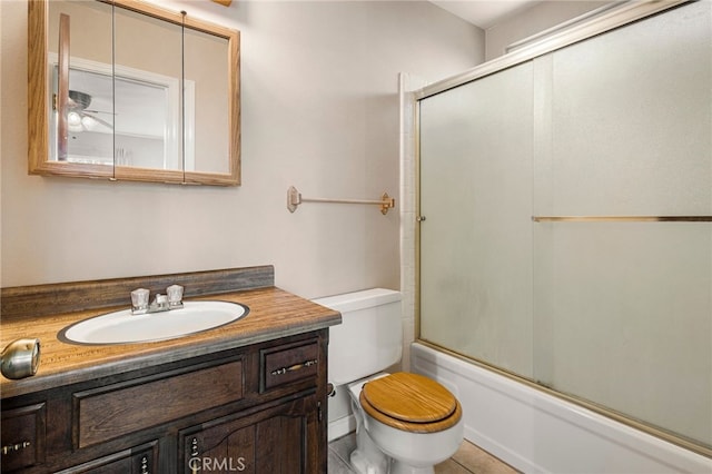 64 Rebie Way, Oroville, CA 95966 - full bath with toilet, vanity, combined bath / shower with glass door, and tile patterned floors