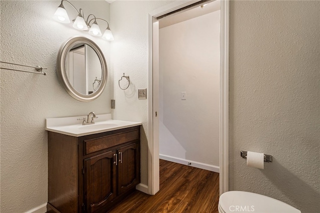 64 Rebie Way, Oroville, CA 95966 - half bath with wood finished floors, vanity, toilet, and baseboards