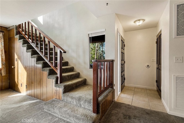 64 Rebie Way, Oroville, CA 95966 - stairway with carpet, tile patterned flooring, and baseboards