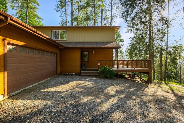 64 Rebie Way, Oroville, CA 95966 - view of front of property with driveway, an attached garage, a deck, and a shingled roof