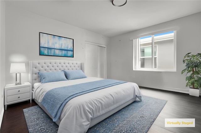 1665 E 84th St, Los Angeles, CA 90001 - bedroom featuring wood finished floors, baseboards, and a closet