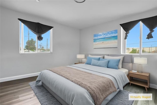1665 E 84th St, Los Angeles, CA 90001 - bedroom featuring baseboards and wood finished floors