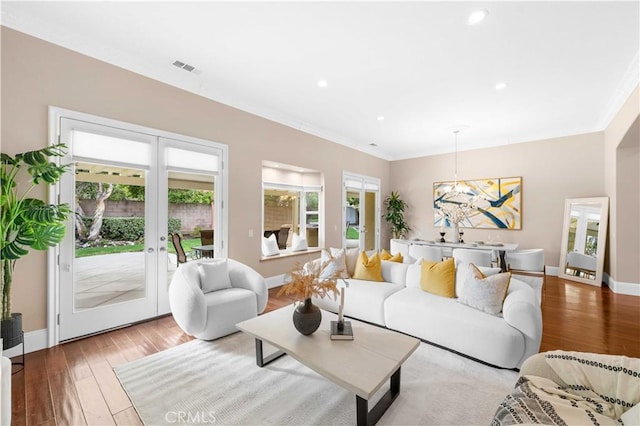 7064 Isle Ct, Rancho Cucamonga, CA 91739 - living room with french doors, wood finished floors, recessed lighting, crown molding, and a chandelier