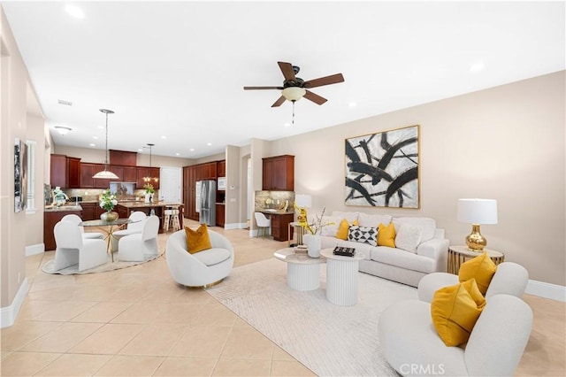 7064 Isle Ct, Rancho Cucamonga, CA 91739 - living room with ceiling fan, recessed lighting, light tile patterned flooring, and baseboards