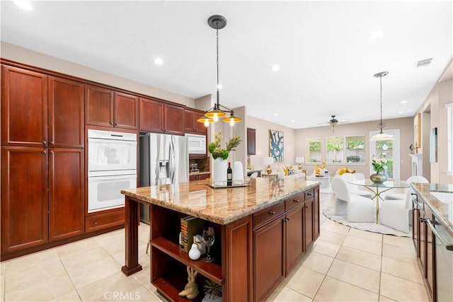 7064 Isle Ct, Rancho Cucamonga, CA 91739 - kitchen featuring white appliances, open shelves, light tile patterned floors, light stone countertops, and open floor plan