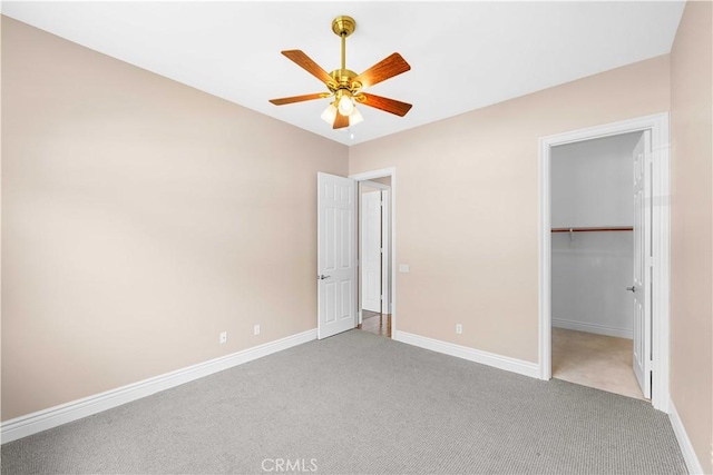 7064 Isle Ct, Rancho Cucamonga, CA 91739 - unfurnished bedroom with carpet, baseboards, a walk in closet, a ceiling fan, and a closet