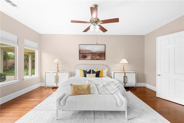 7064 Isle Ct, Rancho Cucamonga, CA 91739 - bedroom with wood finished floors, baseboards, and a ceiling fan