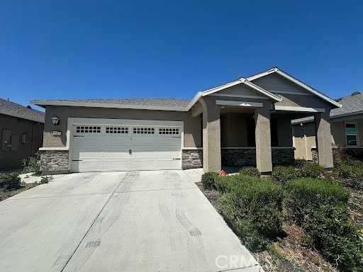 2267 Lavender Pl, Rio Vista, CA 94571 - ranch-style home with an attached garage, concrete driveway, stone siding, and stucco siding