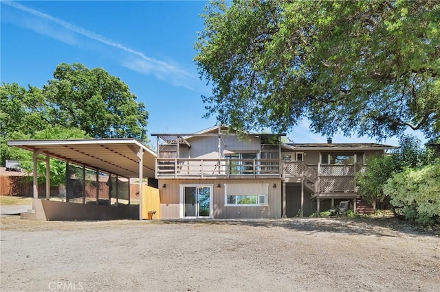 8950 Pueblo Ave, Atascadero, CA 93422 - back of house featuring a carport, stairs, driveway, and a deck