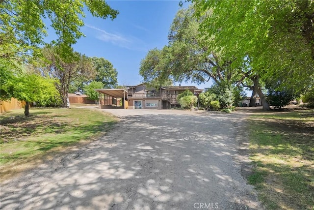 8950 Pueblo Ave, Atascadero, CA 93422 - view of front of home featuring driveway, a carport, and a wooden deck