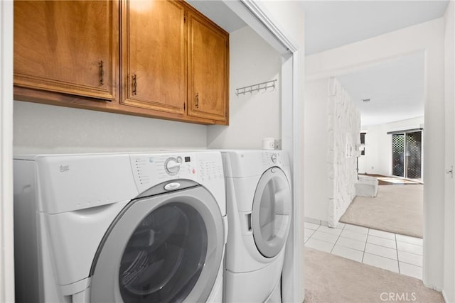 8950 Pueblo Ave, Atascadero, CA 93422 - laundry room featuring cabinet space, carpet flooring, tile patterned flooring, and washer and dryer