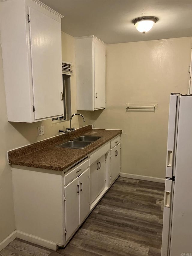 386771 Menlo Ave, San Diego, CA 92105 - kitchen featuring white refrigerator with ice dispenser, a sink, baseboards, and white cabinets