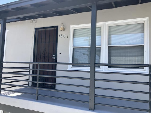 386771 Menlo Ave, San Diego, CA 92105 - doorway to property featuring stucco siding