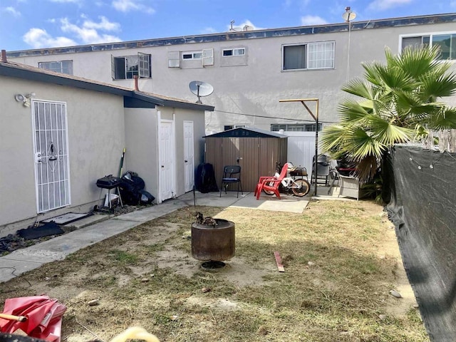 386771 Menlo Ave, San Diego, CA 92105 - rear view of house featuring stucco siding and a patio area