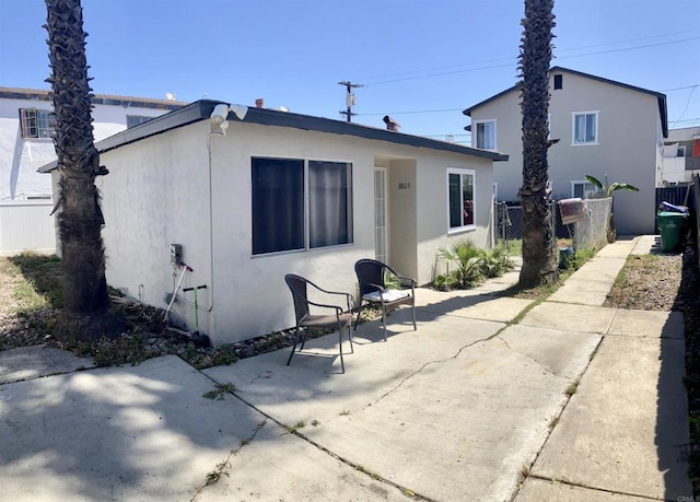386771 Menlo Ave, San Diego, CA 92105 - back of house featuring stucco siding and a patio