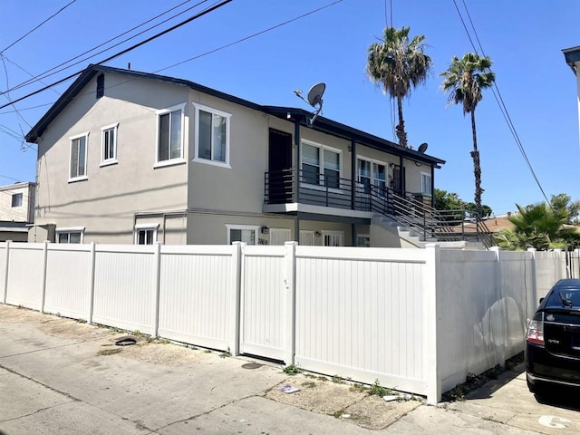 386771 Menlo Ave, San Diego, CA 92105 - view of front of house featuring stucco siding and a fenced front yard