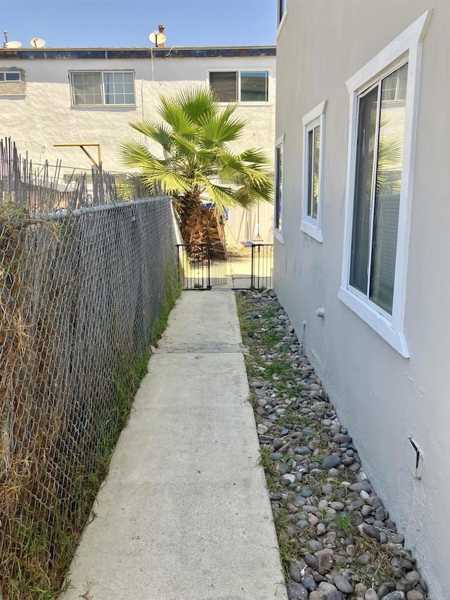 386771 Menlo Ave, San Diego, CA 92105 - view of property exterior featuring stucco siding and a gate