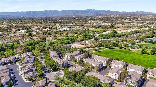 23402 Brookdale Ln Unit 56, Valencia, CA 91355 - aerial view of property's location with a mountainous background and nearby suburban area