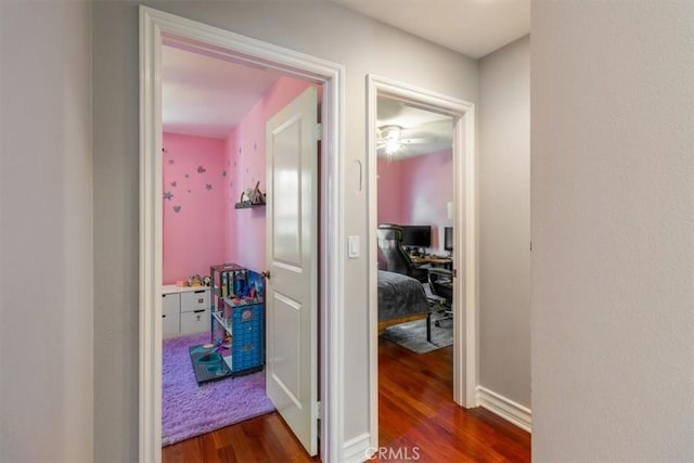 23402 Brookdale Ln Unit 56, Valencia, CA 91355 - corridor with dark wood-style floors and a desk