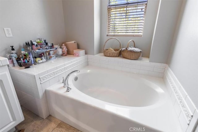 23402 Brookdale Ln Unit 56, Valencia, CA 91355 - bathroom featuring a garden tub and tile patterned floors