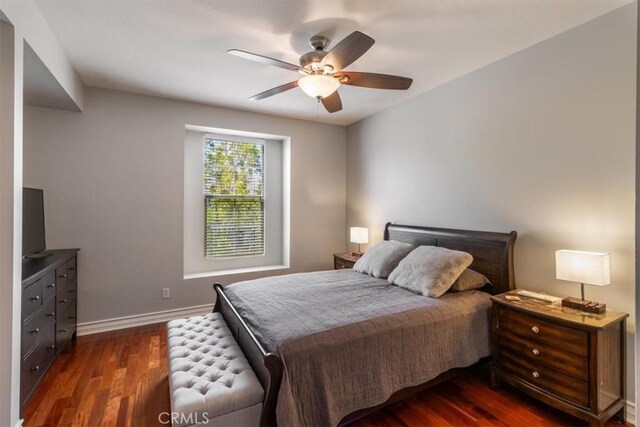 23402 Brookdale Ln Unit 56, Valencia, CA 91355 - bedroom with dark wood-type flooring and ceiling fan