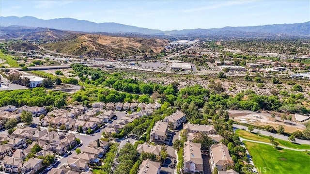 23402 Brookdale Ln Unit 56, Valencia, CA 91355 - aerial view of property and surrounding area featuring a mountain backdrop and nearby suburban area