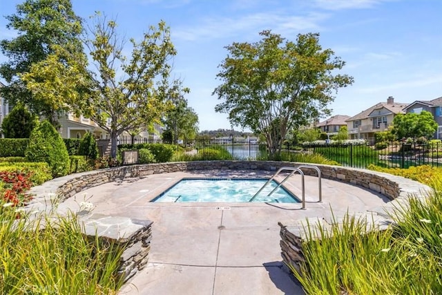 23402 Brookdale Ln Unit 56, Valencia, CA 91355 - view of pool featuring a hot tub, a residential view, and a patio area