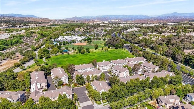 23402 Brookdale Ln Unit 56, Valencia, CA 91355 - aerial view of property and surrounding area featuring a mountainous background and nearby suburban area