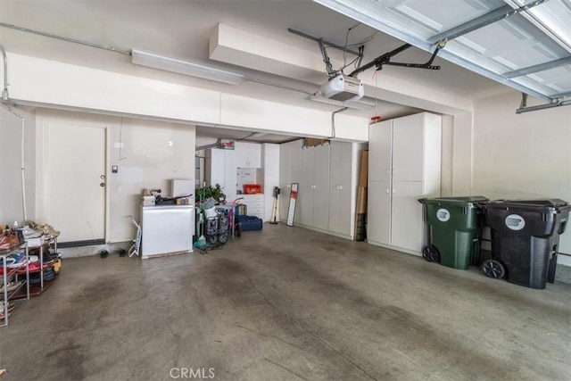 23402 Brookdale Ln Unit 56, Valencia, CA 91355 - garage featuring a garage door opener