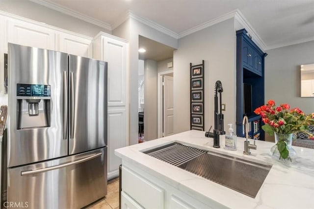 23402 Brookdale Ln Unit 56, Valencia, CA 91355 - kitchen with stainless steel fridge with ice dispenser, light stone counters, white cabinetry, and crown molding