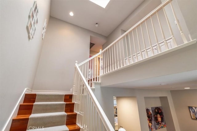 23402 Brookdale Ln Unit 56, Valencia, CA 91355 - stairway with a high ceiling, wood finished floors, and recessed lighting
