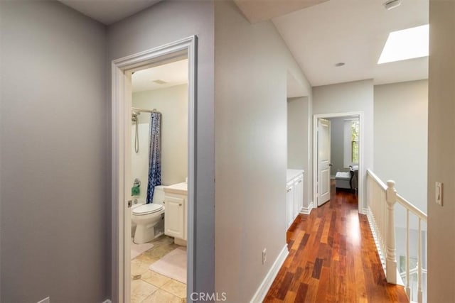 23402 Brookdale Ln Unit 56, Valencia, CA 91355 - hall with a skylight, an upstairs landing, and wood finished floors