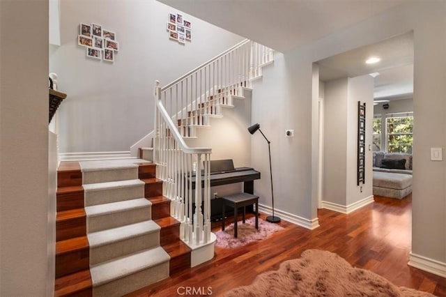 23402 Brookdale Ln Unit 56, Valencia, CA 91355 - staircase featuring wood finished floors and recessed lighting
