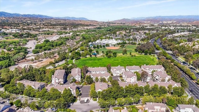 23402 Brookdale Ln Unit 56, Valencia, CA 91355 - aerial view of property and surrounding area featuring a mountain backdrop and nearby suburban area