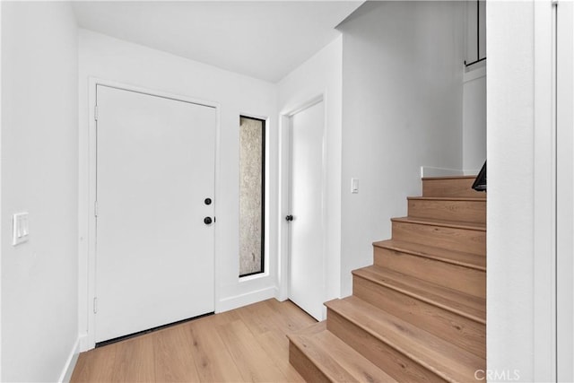 659 Valley Oak Ln, Newbury Park, CA 91320 - entrance foyer featuring light wood-type flooring, stairway, and baseboards