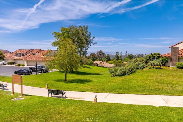 659 Valley Oak Ln, Newbury Park, CA 91320 - surrounding community featuring a garage, driveway, a yard, and a residential view