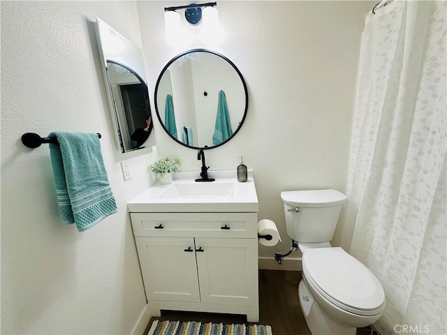 659 Valley Oak Ln, Newbury Park, CA 91320 - bathroom with vanity, toilet, baseboards, wood finished floors, and curtained shower