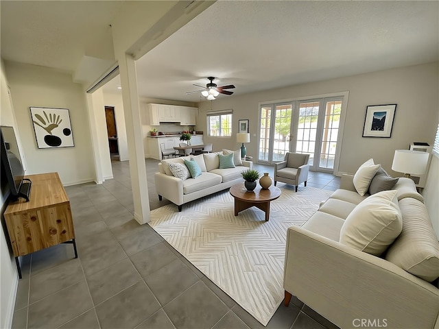 4950 Via Campeche, Riverside, CA 92507 - tiled living room featuring ceiling fan and baseboards