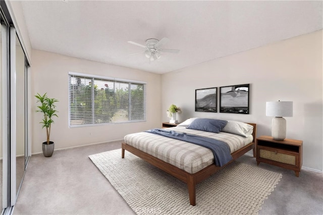 4950 Via Campeche, Riverside, CA 92507 - bedroom featuring light carpet, baseboards, a closet, and a ceiling fan