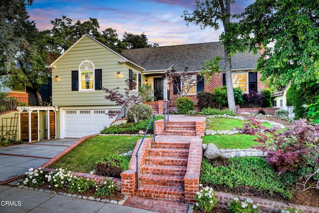 1421 Oneonta Knl, South Pasadena, CA 91030 - view of front of property featuring a garage, concrete driveway, a shingled roof, a front lawn, and brick siding