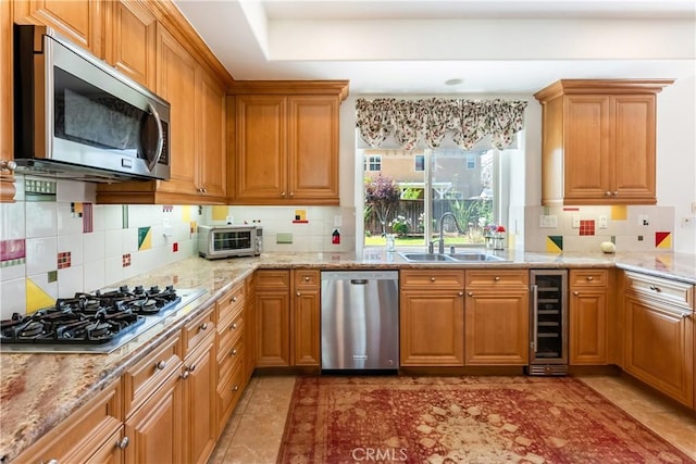 7659 Balasiano Ave, West Hills, CA 91304 - kitchen featuring stainless steel appliances, a sink, beverage cooler, backsplash, and light stone counters