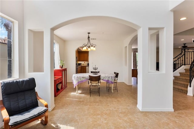 7659 Balasiano Ave, West Hills, CA 91304 - dining room featuring arched walkways, stairway, light tile patterned floors, baseboards, and recessed lighting