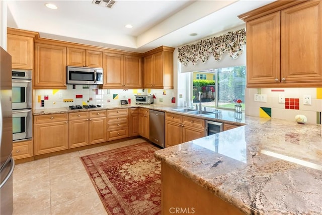 7659 Balasiano Ave, West Hills, CA 91304 - kitchen with stainless steel appliances, a sink, tasteful backsplash, light tile patterned flooring, and wine cooler