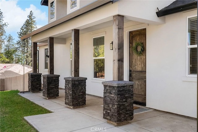 5755 Fickett Ln, Paradise, CA 95969 - view of exterior entry with stucco siding and covered porch
