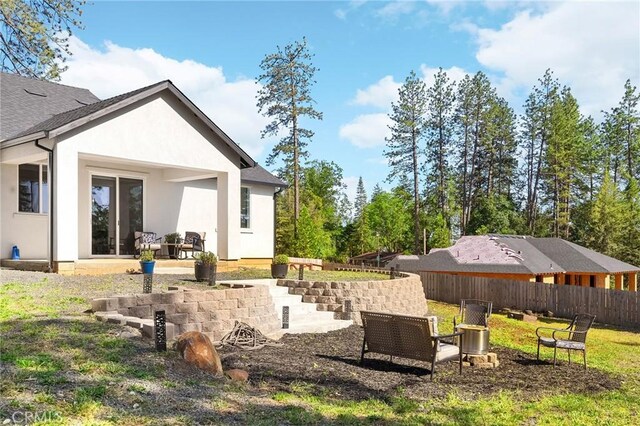 5755 Fickett Ln, Paradise, CA 95969 - back of property with stucco siding and a patio