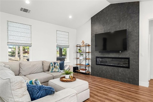 5755 Fickett Ln, Paradise, CA 95969 - living room with wood finished floors, vaulted ceiling, a fireplace, recessed lighting, and baseboards