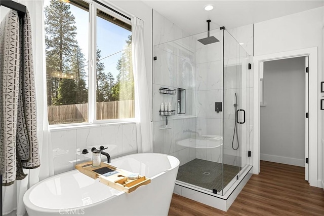 5755 Fickett Ln, Paradise, CA 95969 - full bathroom with a freestanding tub, wood finished floors, a stall shower, baseboards, and recessed lighting