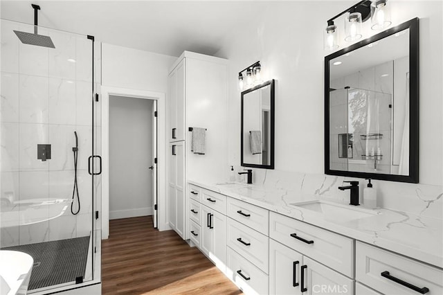 5755 Fickett Ln, Paradise, CA 95969 - bathroom with a marble finish shower, double vanity, wood finished floors, and baseboards