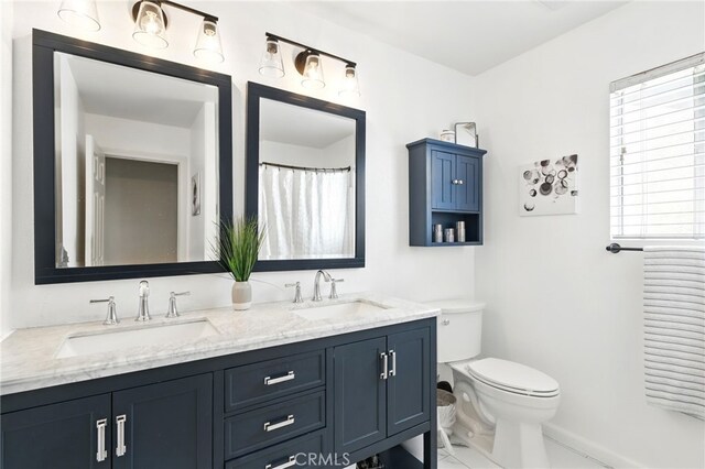 25 Del Brienza, Lake Elsinore, CA 92532 - full bathroom featuring double vanity and toilet